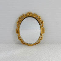 oval spejl med metal guldramme