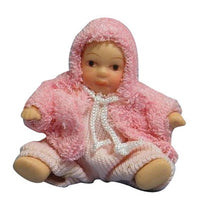 Baby, pige i rosa strik