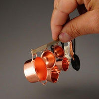 Gryde ophæng m/ kobbergryder, hvidløg + æbleskivepande, reutters