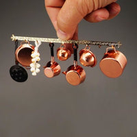 Gryde ophæng m/ kobbergryder, hvidløg + æbleskivepande, reutters