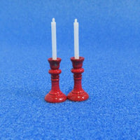 2 røde lysestager m. lys